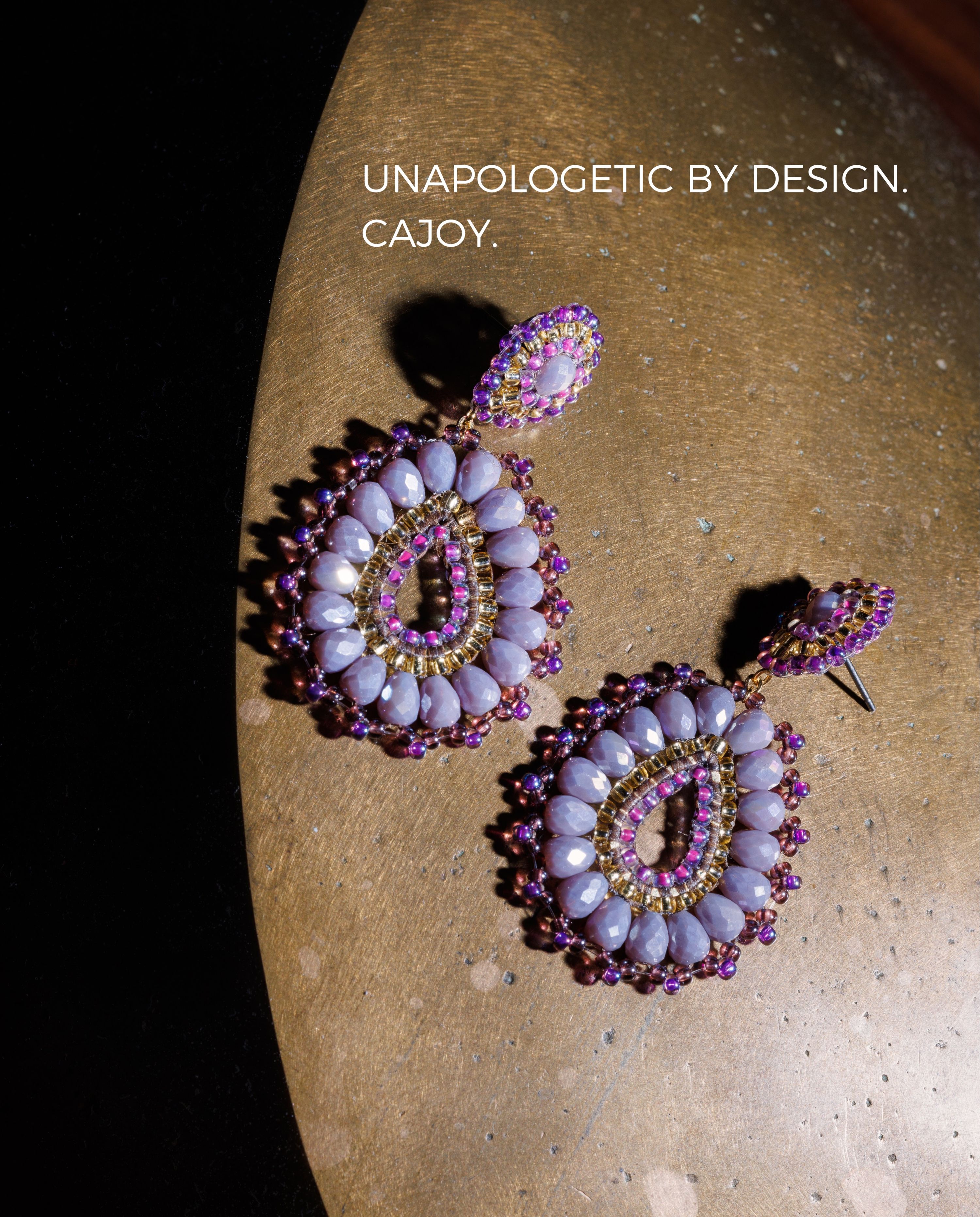 PLOT TWIST: FALL WEARS LILAC 💜

Who decided September had to be brown?

The BOHO DROP LIGHT PURPLE is our official argument for keeping a little summer energy around soft lilac, statement sparkle and very much refusing to blend into a sea of beige.

Wear them with grey tailoring. Chocolate brown. Denim. Black. Or whatever you grabbed five minutes before leaving the house.
Seasonal color rules? We don’t know her.

BOHO DROP LIGHT PURPLE from the CAJOY F/W 2026 Collection ✨